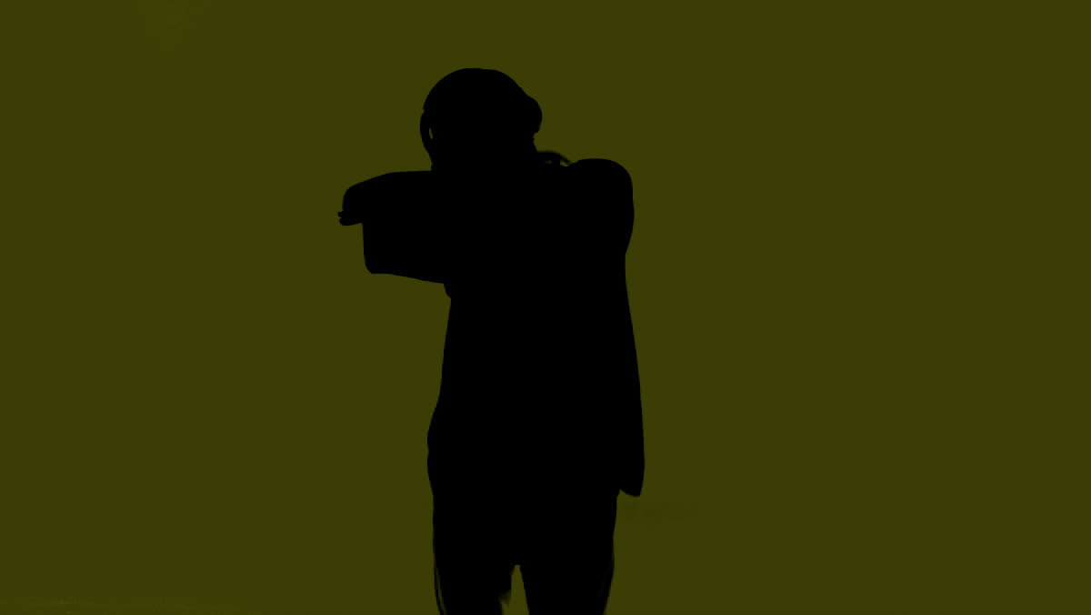 Silhouette of a dancer on flat yellow